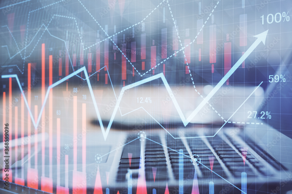 Forex market graph hologram and personal computer on background. Multi exposure. Concept of investment. Forex market graph hologram and personal computer on background. Multi exposure. Concept of investment.