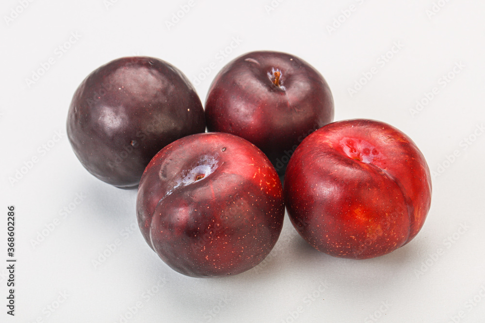Ripe sweet plum fruit heap
