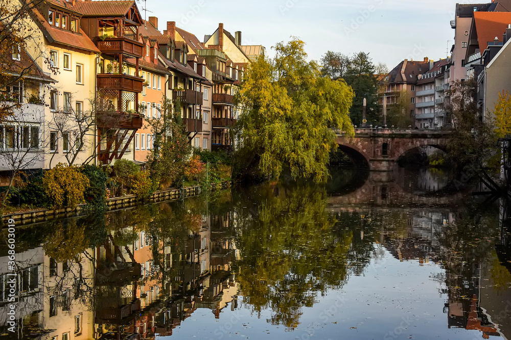 A colourful view of the old houses on the banks of the Pegnitz river in Nuremberg, Bavaria, Germany. October 2014
