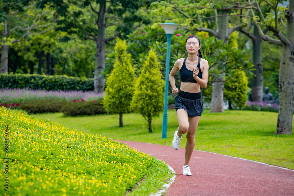 Young women run for fitness in the morning