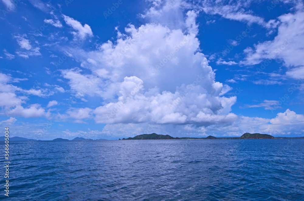 Beautiful white clouds in blue sky over the sea