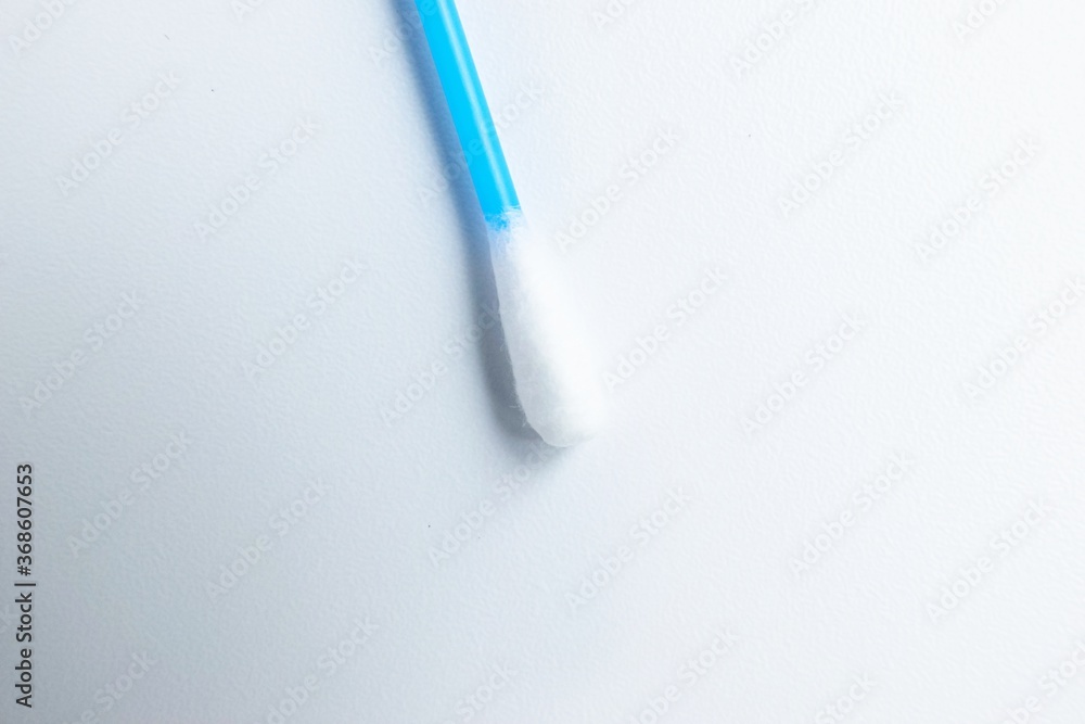 Cotton sticks ear blue plastic on a white background. Personal hygiene and care. Cosmetology and medicine. Cotton sticks ear blue plastic on a white background. Personal hygiene and care. Cosmetology and medicine.