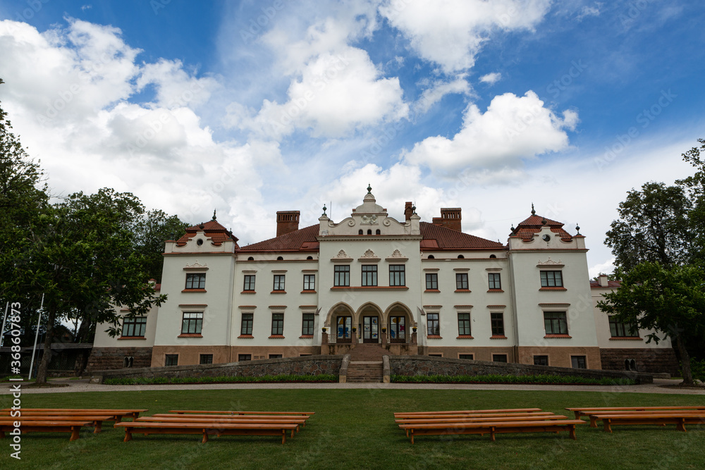 Rokiskis manor and park in sunny summer day