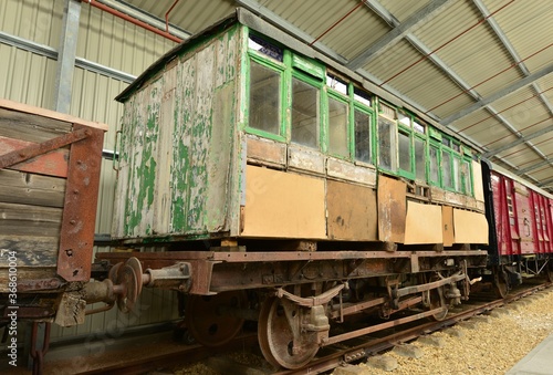 A Rotten railway carriage in a warehouse.