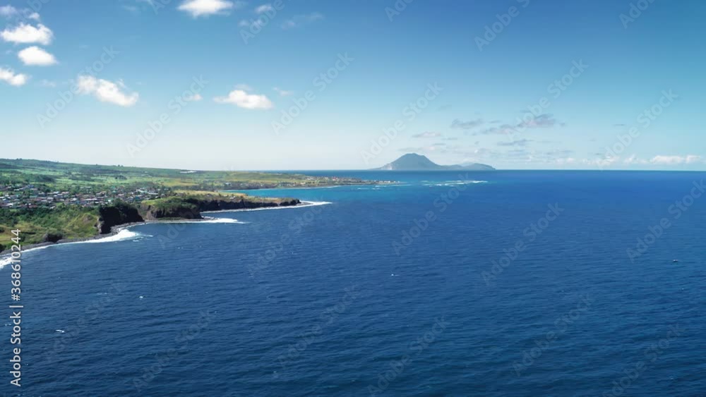 Aerial drone filming the settlemenit on the shore and mountain in Saint Kitts and Nevis Aerial drone filming the settlemenit on the shore and mountain in Saint Kitts and Nevis