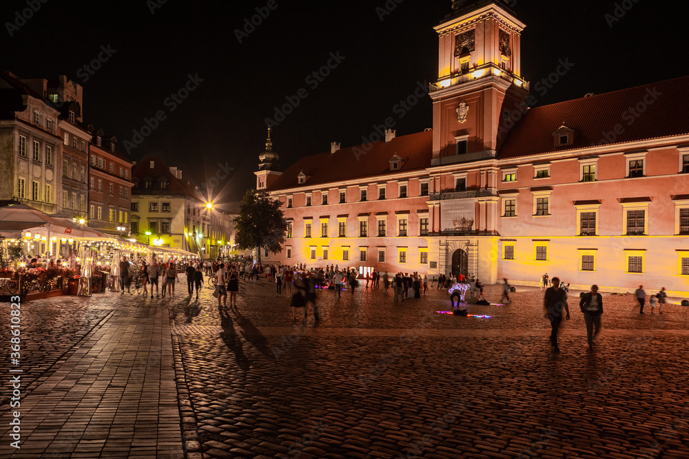 Obraz premium Warsaw city center is illuminated at night by artificial lighting