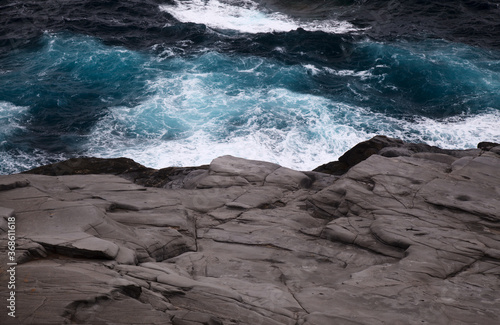 North coast of Gran Canaria, Canary Islands, Banaderos area, grey volcanic phonolite rock photo