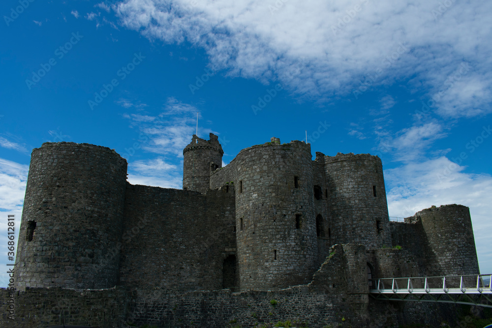 Wales, the historic seaside town of Harlech.  The imposing medieval castle. The gateway to the monument with rounded defensive towers and walls.