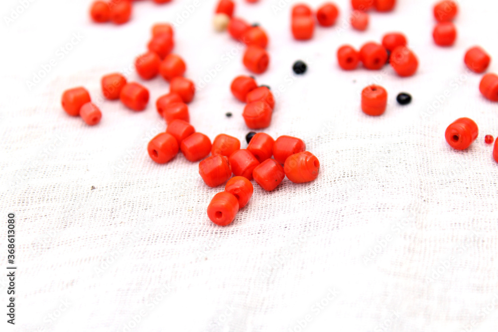 some red and black stone pearl isolated on white background some red and black stone pearl isolated on white background