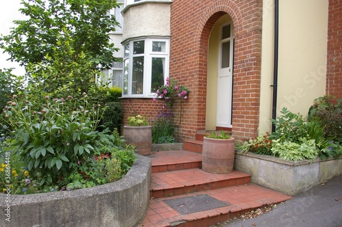 The front steps and entrance to a 1930s semi-detached house in England.