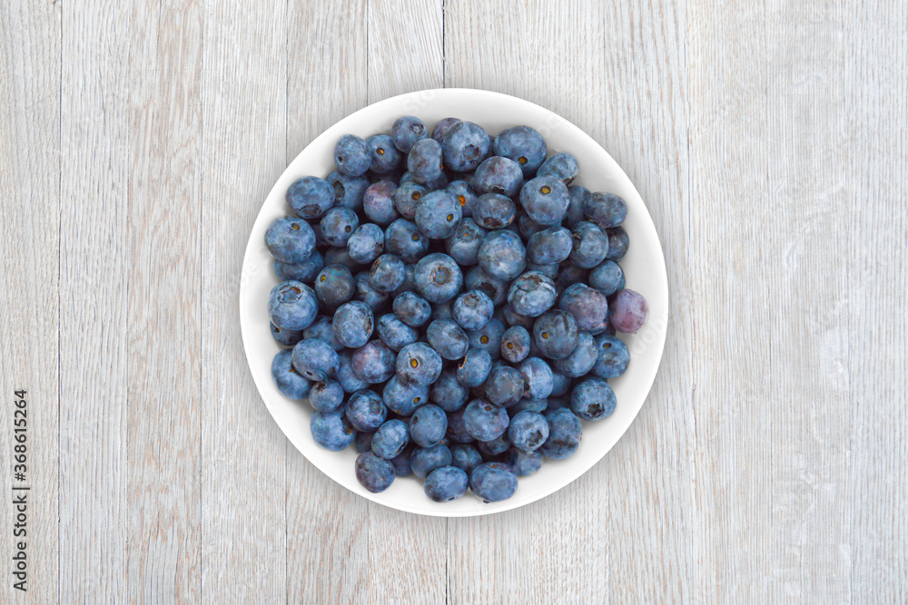 Beverage of fresh blueberry on a plate on a wooden table. Beverage of fresh blueberry on a plate on a wooden table.