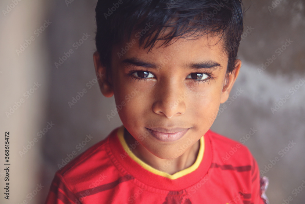 Portrait Indian little boy posing to camera
Portrait Indian little boy posing to camera