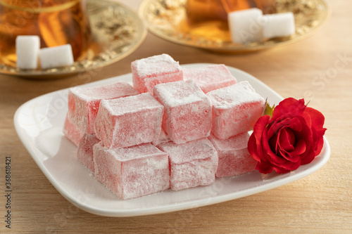 Turkish rose delight and a fresh rose