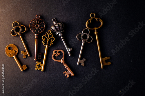 Many different old keys from different locks, scattered chaotically,