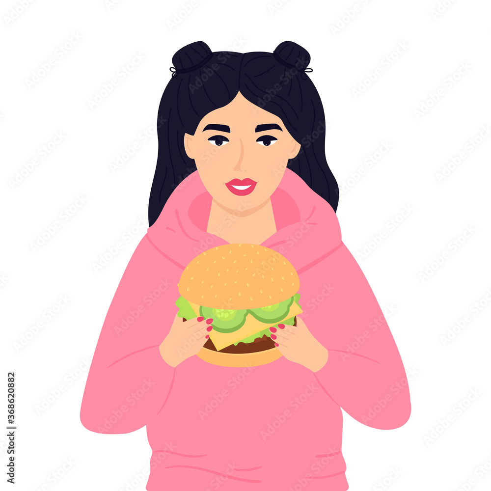 A teenage girl holding a huge burger. Street fast food. Unhealthy eating A teenage girl holding a huge burger. Street fast food. Unhealthy eating