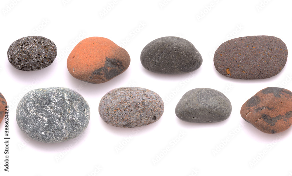 Pebbles of various colors and textures isolated on white backgorund, seamless repeatable border Pebbles of various colors and textures isolated on white backgorund, seamless repeatable border