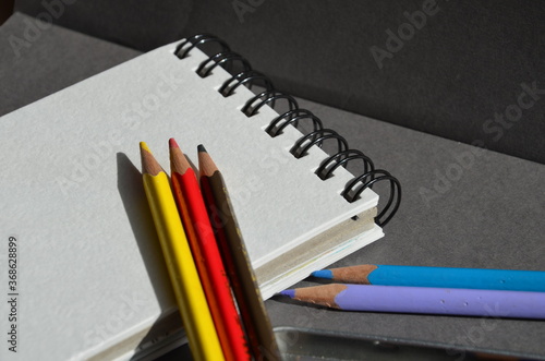 Colored pencils and a notebook