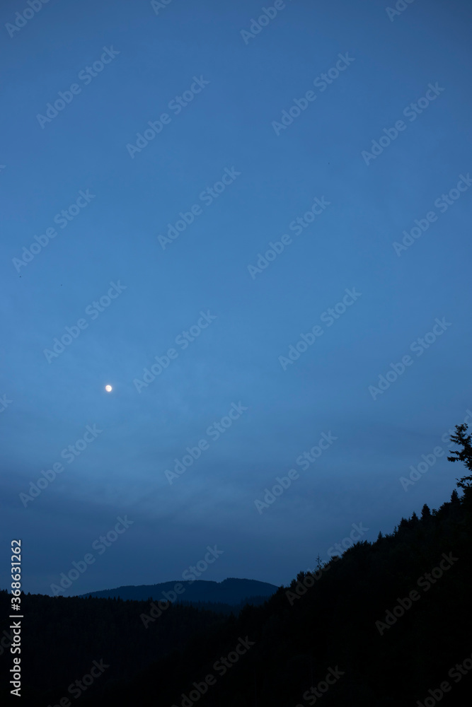 Night sky against the backdrop of beautiful mountains