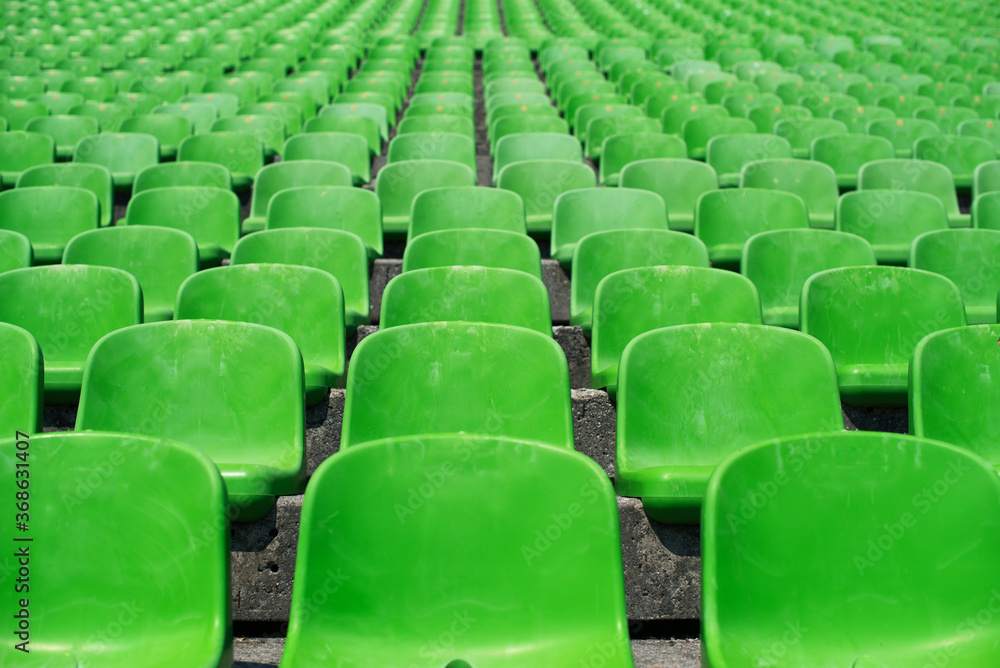 Obraz premium rows of green stadium seats 