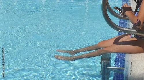 Girl By The Pool With Smartphone