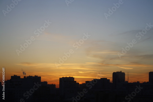 sunset over the city © Yulia