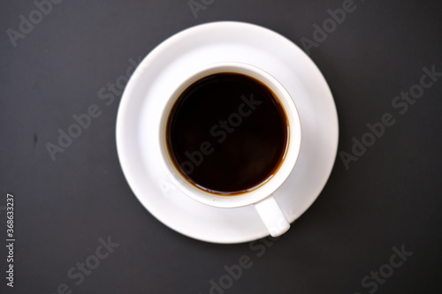 Top view coffee cup and coffee beans on old wood table background, space for text