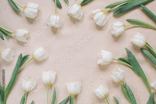 Elegant floral composition with white flowers and copy space in the centre. Branding mock up, holiday marketing concept.