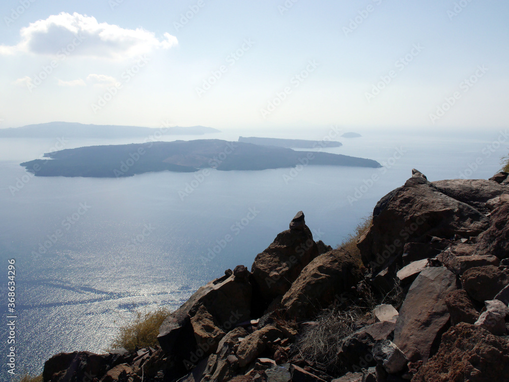 Panoramic view of mountains, sea and nature from Fira town, Santorini island Greece. View of the caldera and ships in the bay. Panoramic view of mountains, sea and nature from Fira town, Santorini island Greece. View of the caldera and ships in the bay.
