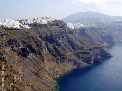 Panoramic view of mountains, sea and nature from Fira town, Santorini island Greece. View of the caldera and ships in the bay.