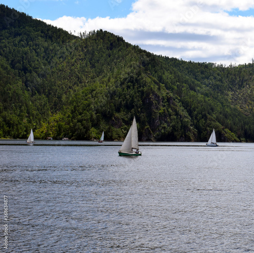 Sailing regatta on the background of the sea and beautiful nature.