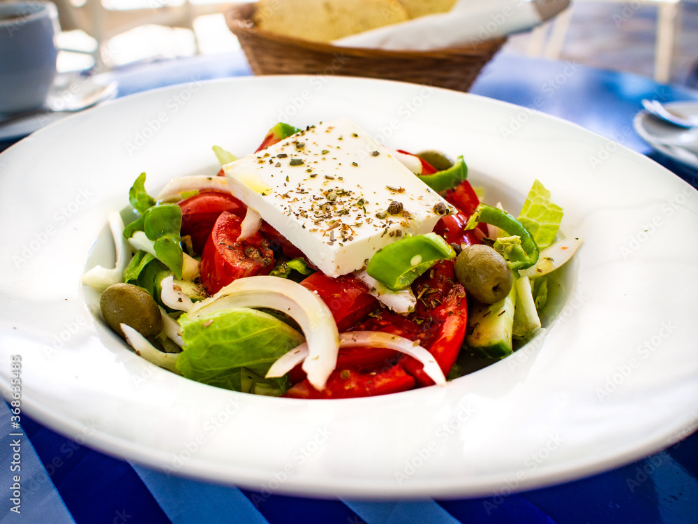 Fresh Greek salad - feta cheese, cherry tomatoes, lettuce, black olives and onion Fresh Greek salad - feta cheese, cherry tomatoes, lettuce, black olives and onion