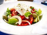 Fresh Greek salad - feta cheese, cherry tomatoes, lettuce, black olives and onion