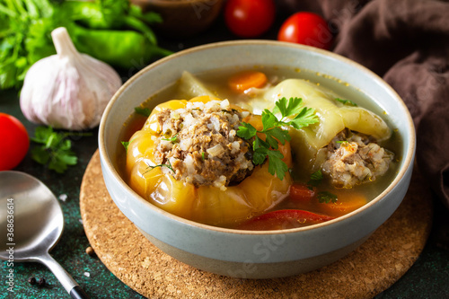 Healthy food. Bell stuffed paprika peppers with meat and bulgur in broth with vegetables.
