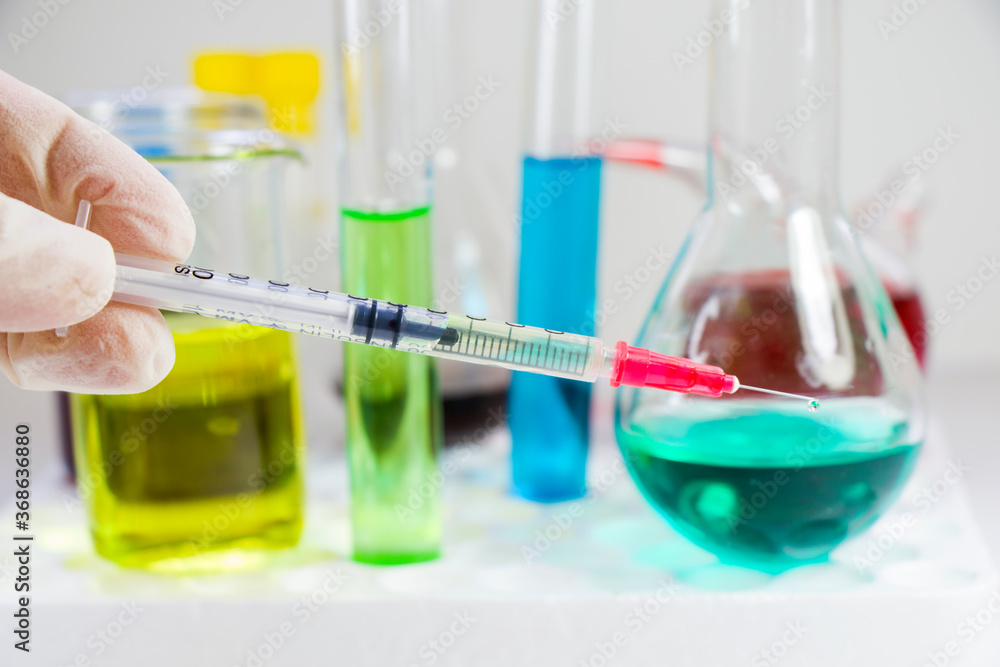 Diabetes vaccine, needle inject with liquid insulin, laboratory diagnoses and injections. Doctors hand. Diabetes vaccine, needle inject with liquid insulin, laboratory diagnoses and injections. Doctors hand.