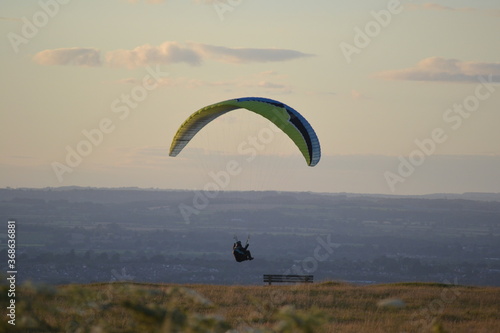 paragliding with summer sun starting to set