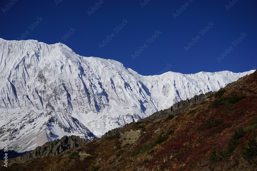 Snowy Tilicho peak, on the way to Tilicho lake and Mesokanto La pass in the Annapurna region of Nepal.