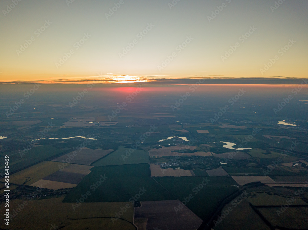 Sunset over the agricultural fields of Ukraine. Aerial drone view. Sunset over the agricultural fields of Ukraine. Aerial drone view.
