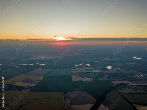 Sunset over the agricultural fields of Ukraine. Aerial drone view.