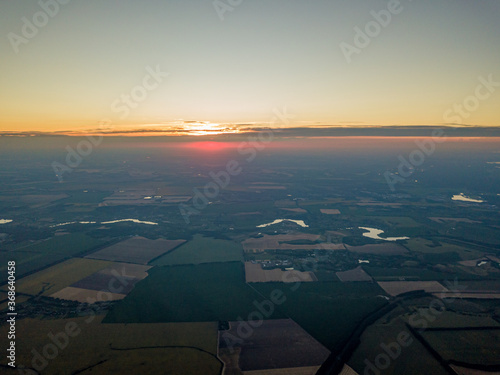 Sunset over the agricultural fields of Ukraine. Aerial drone view. © Sergey
