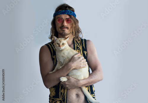 Hippie (hippy) Man holding cream burmese cat photo