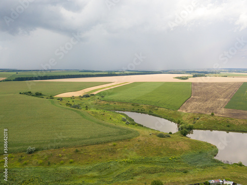 Aerila drone view. Summer rain over agricultural fields in Ukraine.