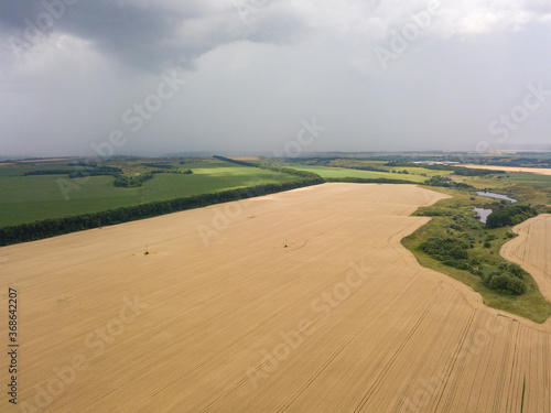 Aerila drone view. Summer rain over agricultural fields in Ukraine.