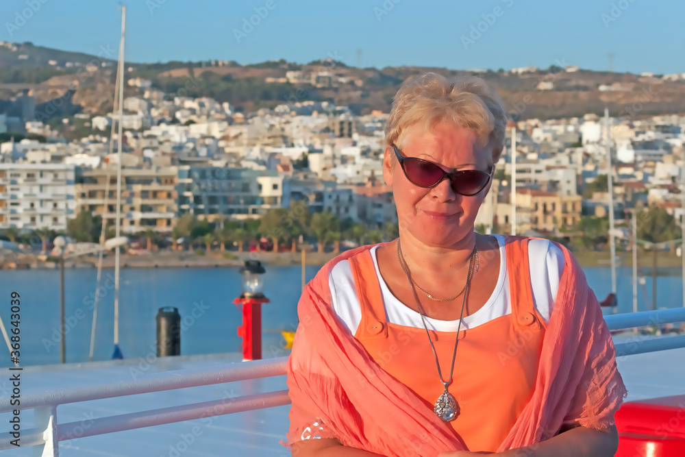 Portrait of middle-aged woman on the deck of the ferry