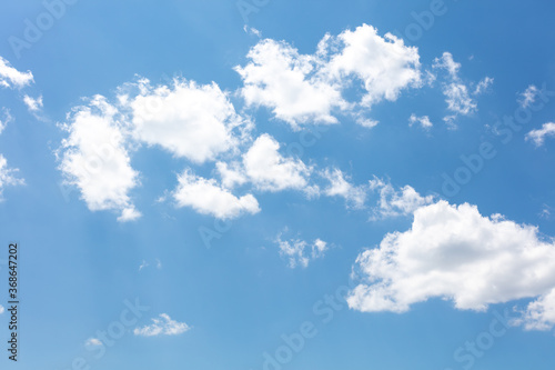 Photography Puffy white clouds in a blue sky