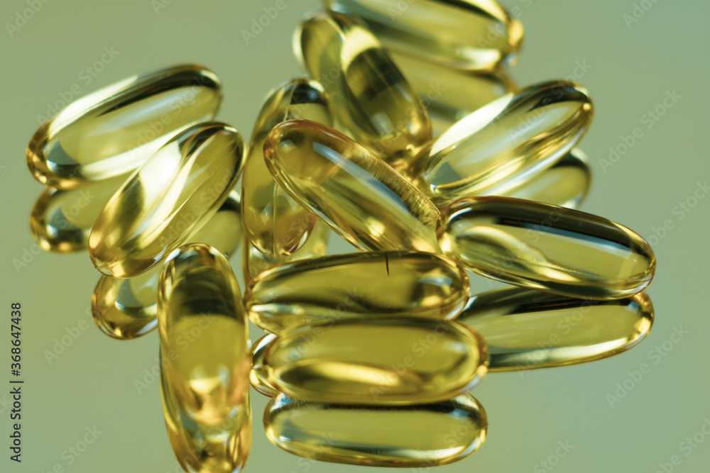 Fish oil capsules on the mirror Fish oil capsules on the mirror