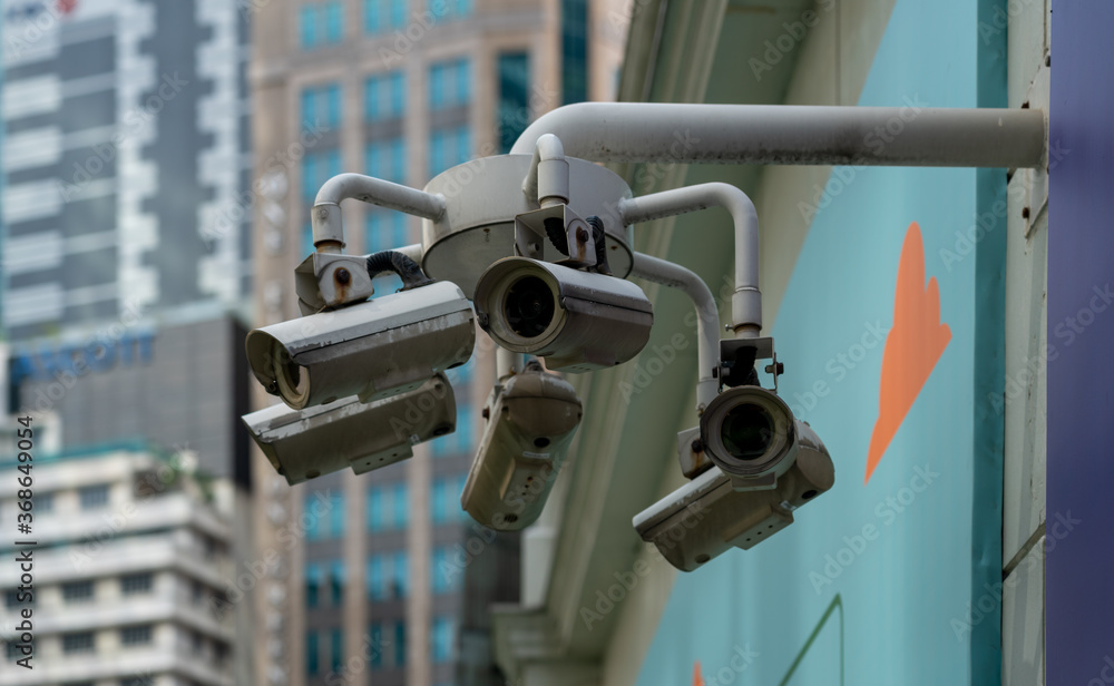 Security camera, Singapore CBD. Big brother is watching you concept Security camera, Singapore CBD. Big brother is watching you concept
