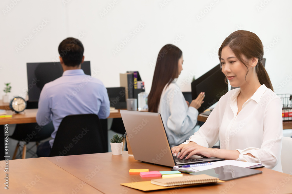 Business asian woman happy working job on laptop in office.
