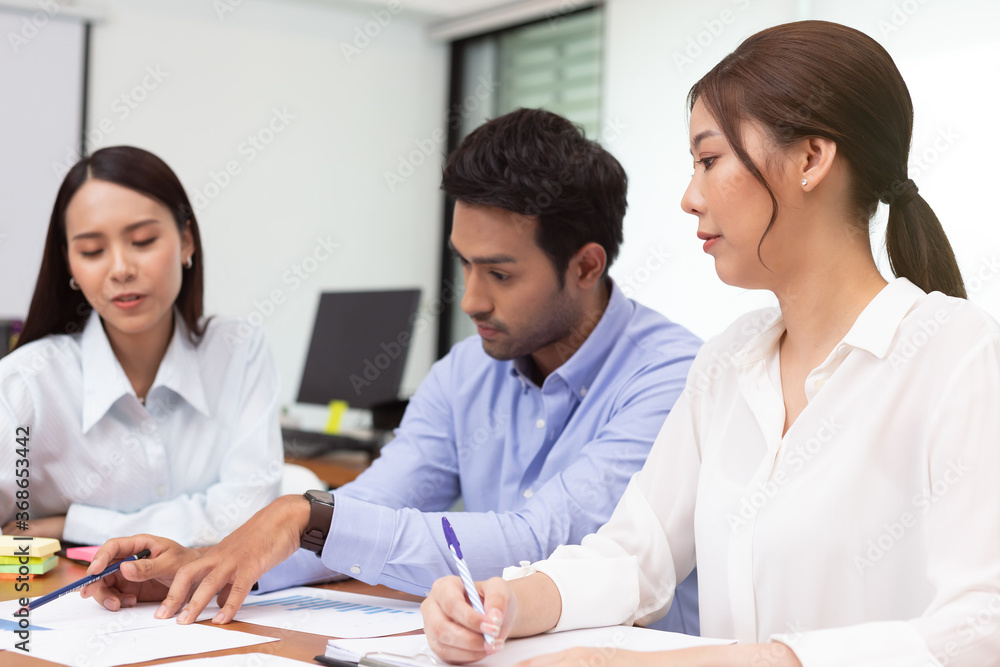 Asian business man and women meeting and talk about job in office.