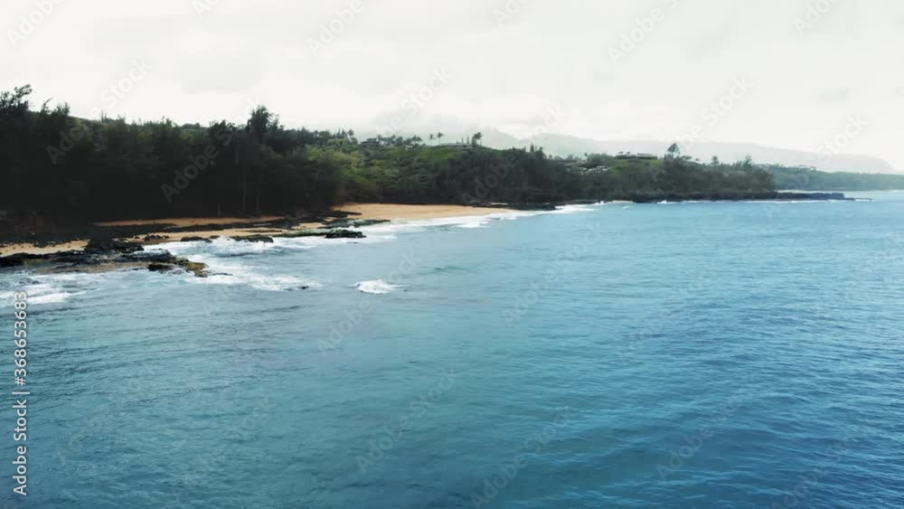 Drone shooting ocean, beach, tropical forest on a rainy day at Kauai, Hawaii, USA Drone shooting ocean, beach, tropical forest on a rainy day at Kauai, Hawaii, USA