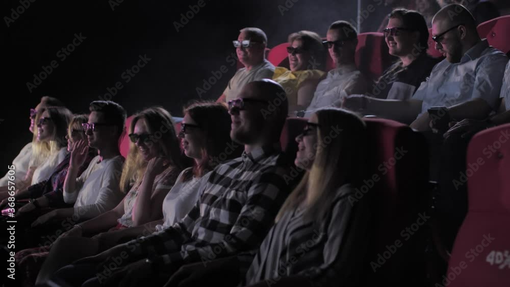 Have learned extinction chicken Close-up of excited cinema-goers in 3d glasses enjoying visit to 4dx cinema  hall of movie theater. Enthusiastic audience watching movie with special  effects while chairs shaking and water spraying Stock Video 